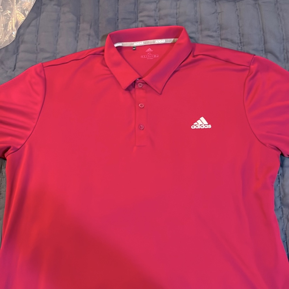 Adidas polo style shirt.  The color is a plum color